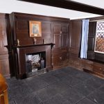 a scene from a 3d virutal tour of Dove Cottage depicting a fireplace